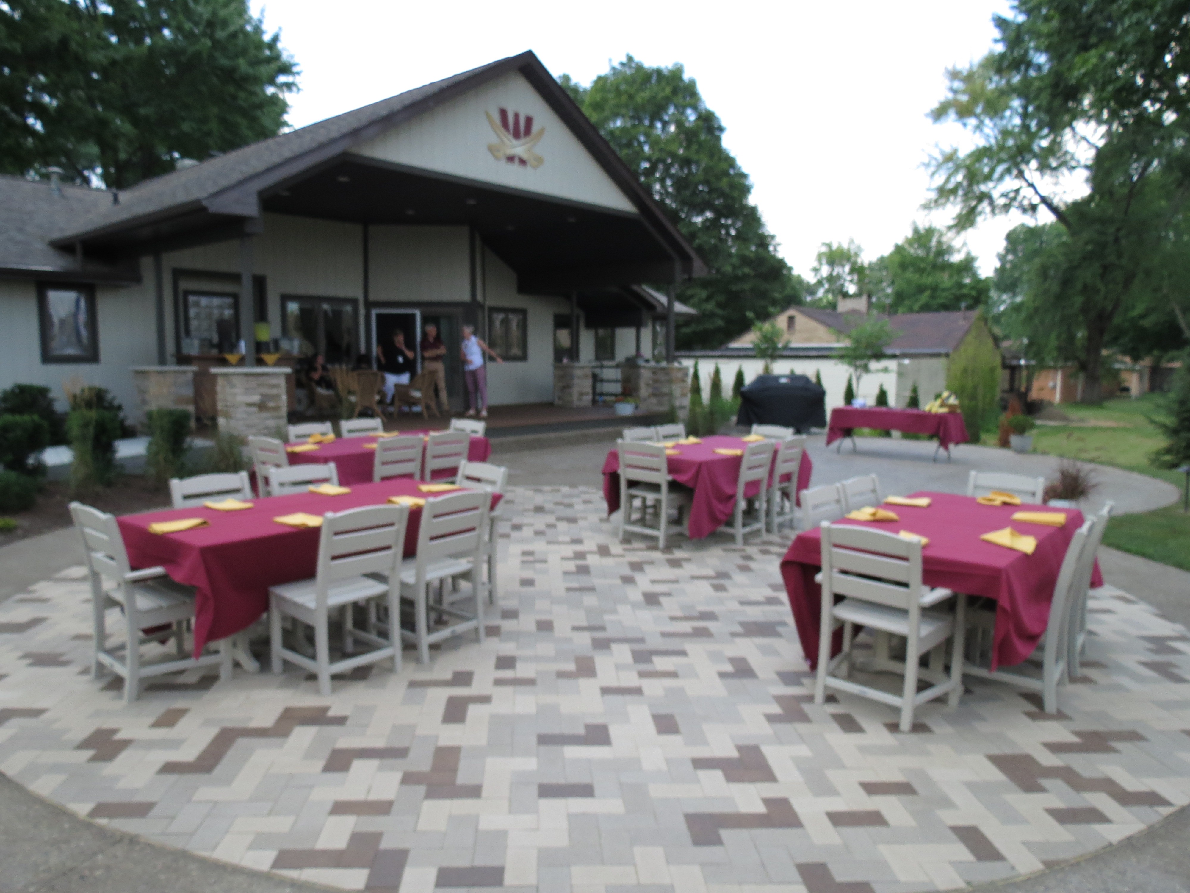 photo: Empty tables on the back patio of the Cav House