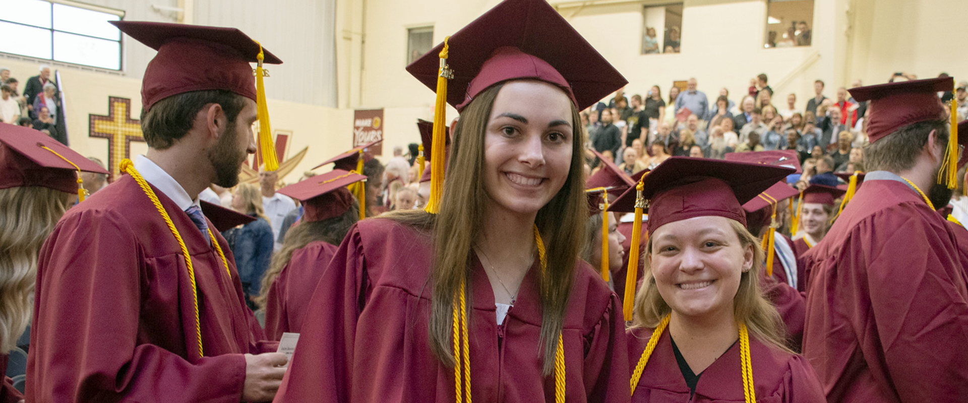 A group of students sitting on a sofa during Bible study.