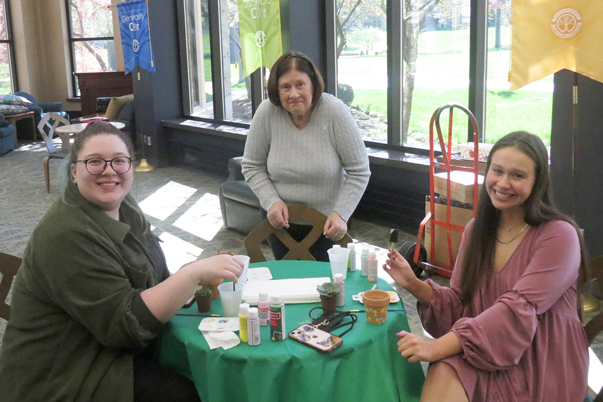 photo: Women's Committee member working with students