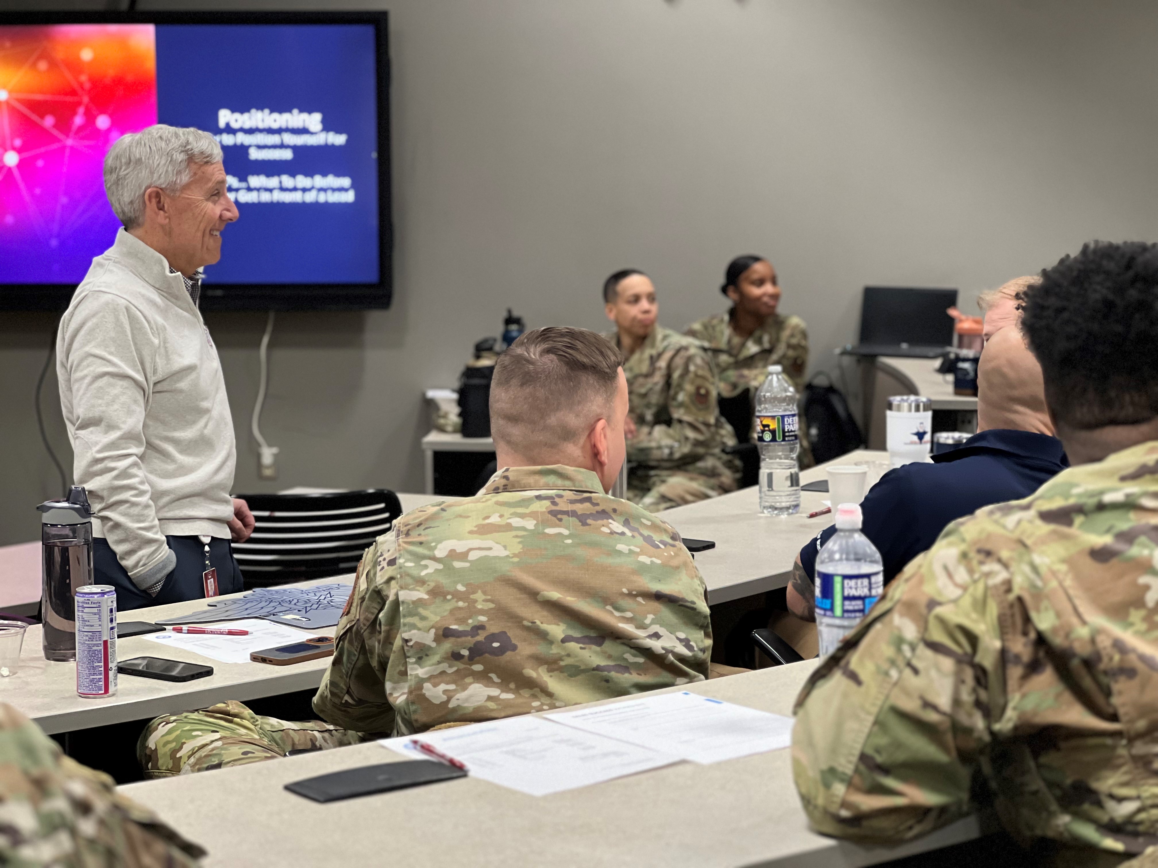 photo of President Tim Collins addressing a group of Air Force service members