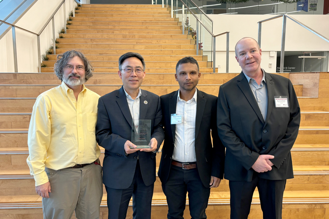 group photo of Innovation Challenge winner and Walsh representatives