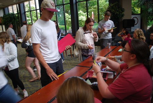 Photo of student checking in for placement testing